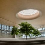 A round room with a tree inside of it