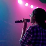 woman holding microphone